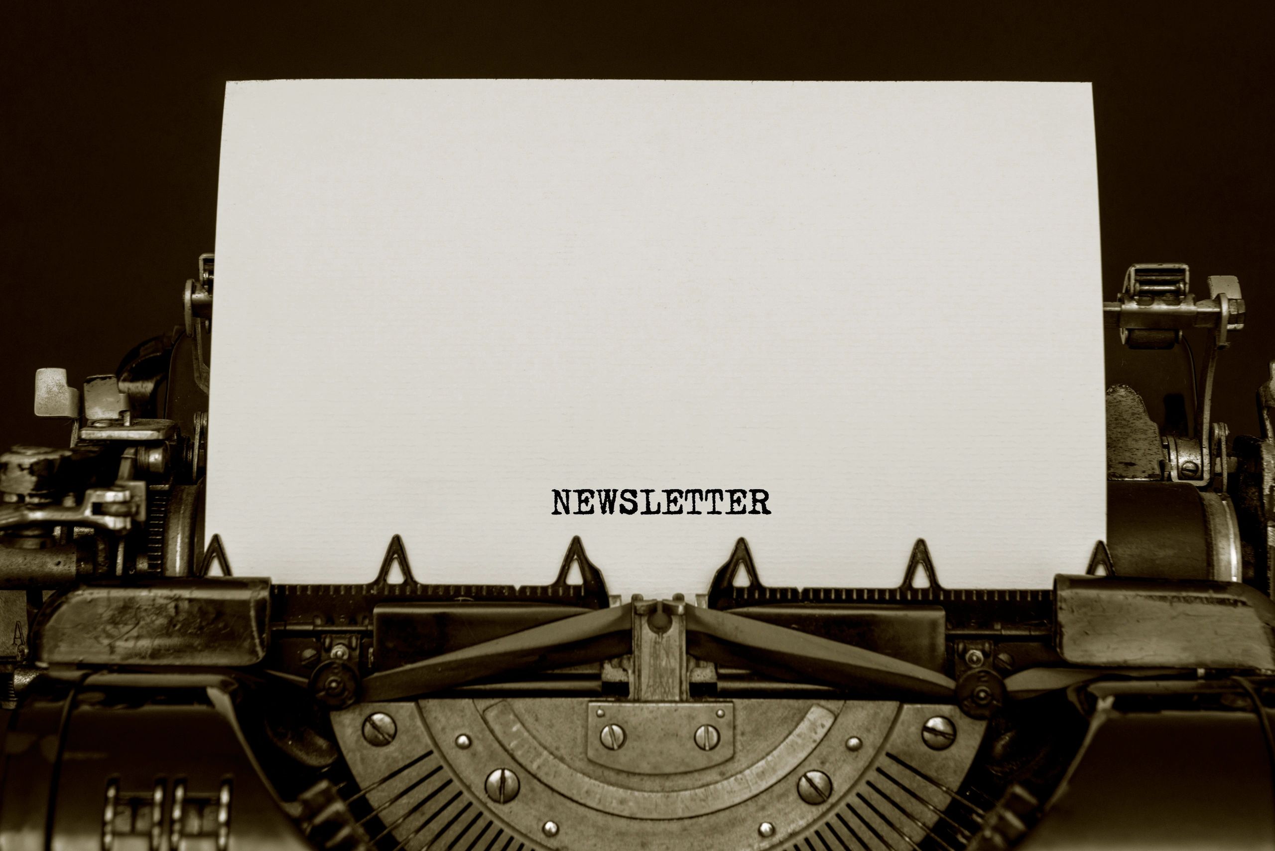 author writing newsletter